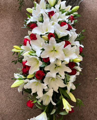 Lily & Rose Spray - A white lily and red roses single ended funeral spray.