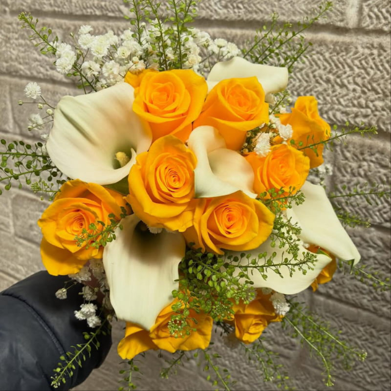 Bride with wedding flowers by A and S Flower Studio