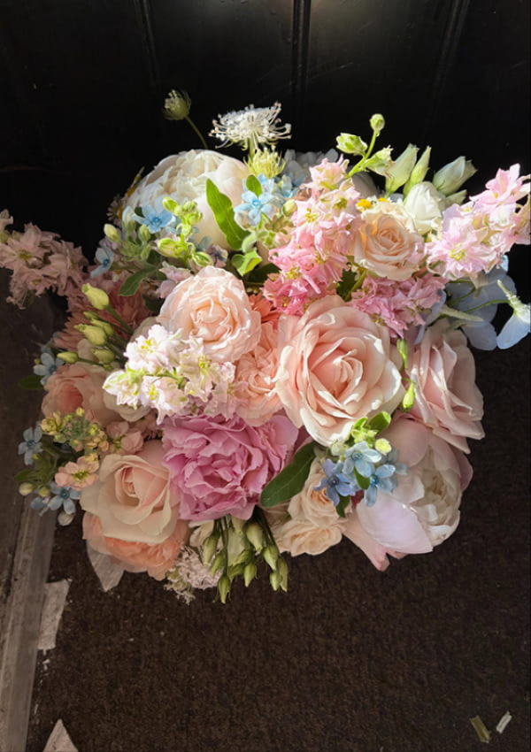Bride holding a handcrafted wedding bouquet