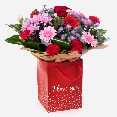 Mrs Kisses - Send lots of love and kisses with this classic hand-tied bouquet featuring a selection of romantic flowers finished with a luxurious single red rose.