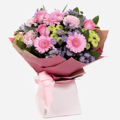 Warm Wishes - Send this vibrant hand-tied featuring a mix of favourite flowers delivered in a delightful gift bag or box is the perfect way to send your thoughts.