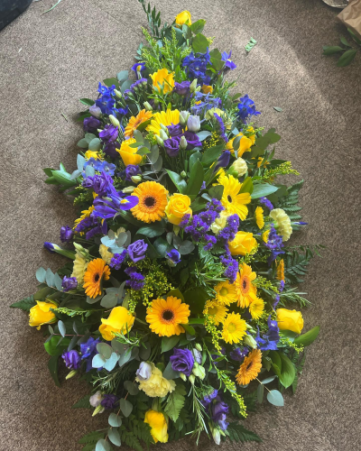 Yellow & Purple Spray - A double ended funeral spray in yellow and purple.