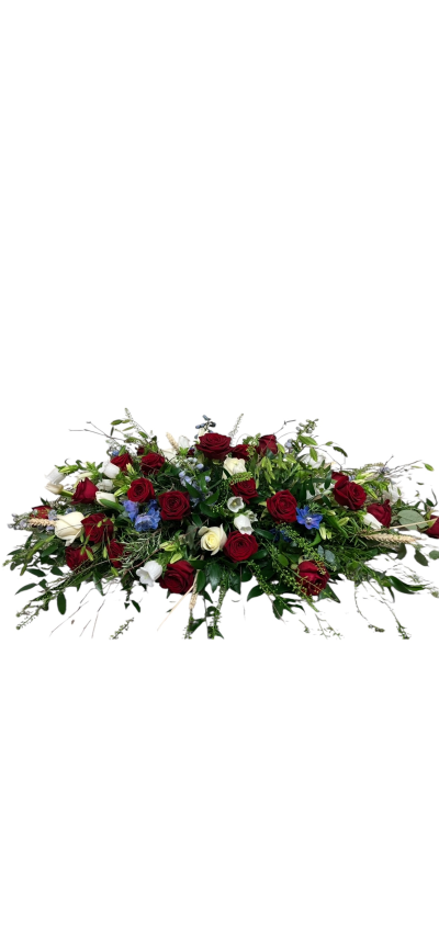 Red, white and blue spray 003 - Red Rose & Blue Accent Coffin Spray
This stunning coffin spray is a heartfelt tribute, featuring an elegant mix of rich red roses, white roses, and delicate blue blooms nestled among fresh seasonal foliage. The combination of deep tones and natural greenery creates a classic yet striking design, perfect for honouring a loved one with beauty and dignity.

Ideal for funerals and memorials, this floral tribute offers a timeless expression of love, respect, and remembrance