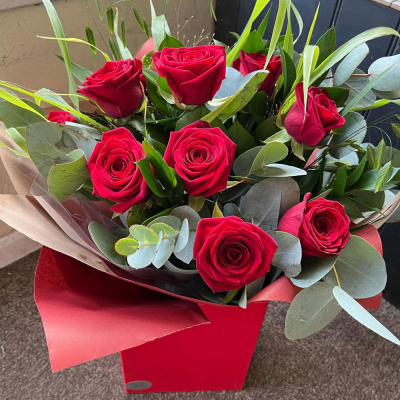 Simply Red Roses - A timeless arrangement of vibrant red roses beautifully presented in a stylish gift bag, perfect for celebrating life's most meaningful moments.