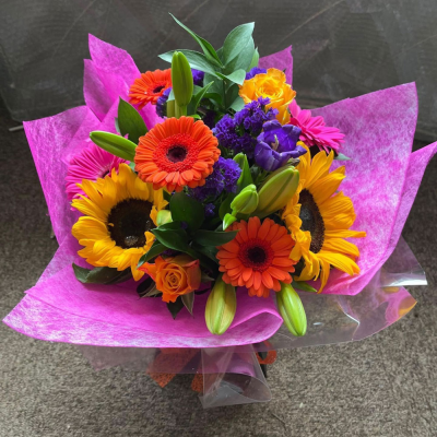 Vibrant Bouquet - A vibrant hand-tied bouquet bursting with bold seasonal colours, carefully arranged to brighten any celebration or special occasion.