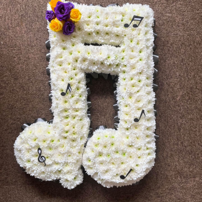 Musical Notes Tribute - A beautifully crafted musical notes tribute, thoughtfully designed to celebrate a life filled with music and cherished memories.