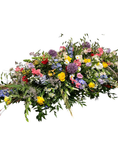 Country Garden Coffin Spray - A vibrant coffin spray filled with cheerful colours, celebrating a life lived with warmth, happiness and love.