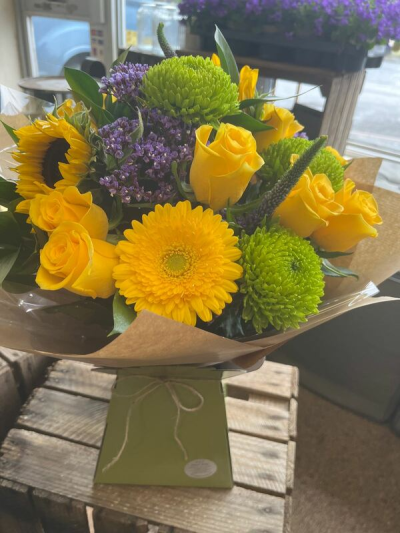 Sunshine Smile - A cheerful arrangement of bright seasonal tones, designed to bring happiness and warmth.